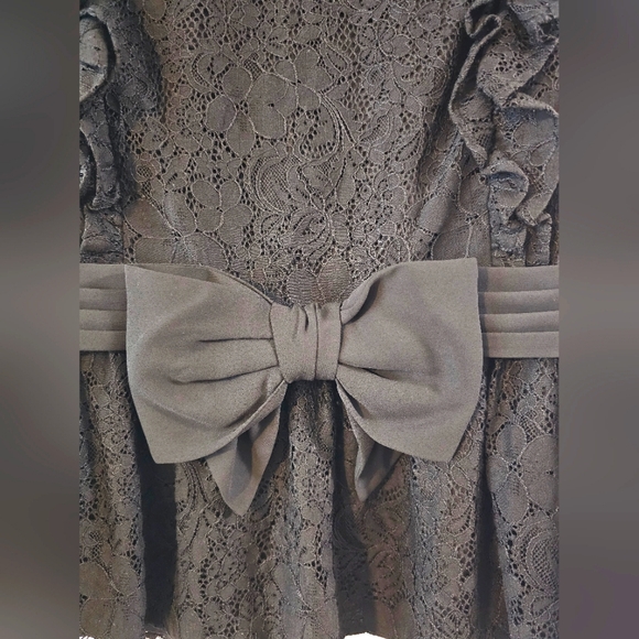 Black CeCe Lace Peplum Top with ruffled sleeves size S with a Bow accent - Picture 2 of 8